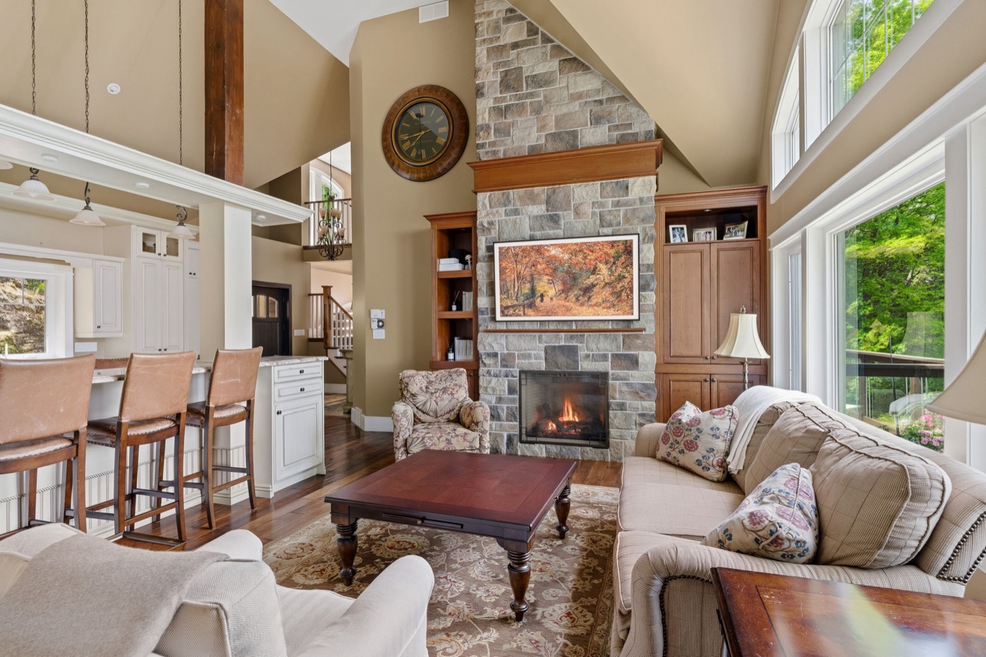 Great room with stone fireplace and cathedral ceilings